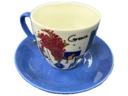 Cappuccino kop en schotel Grieks tafereel